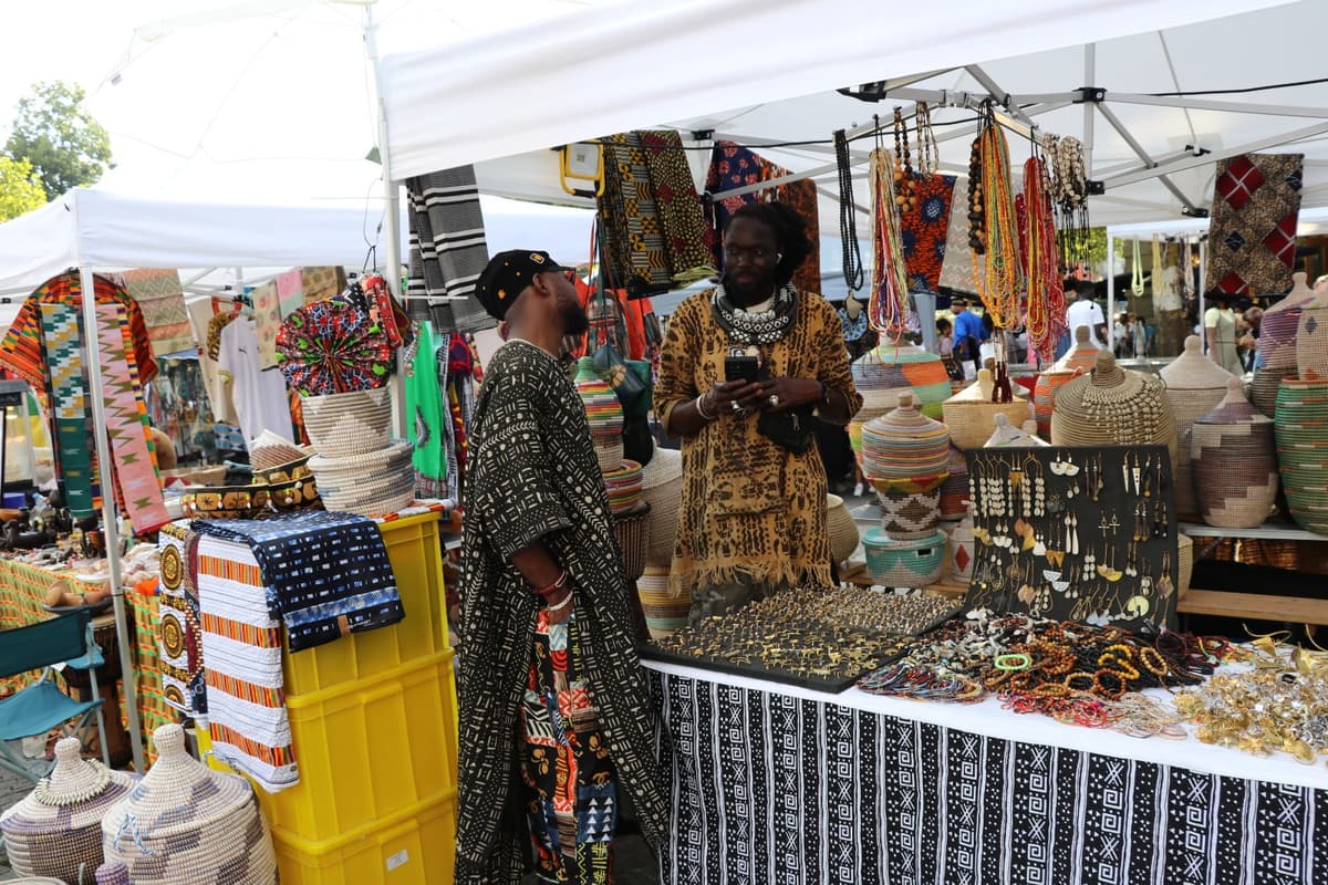 Festival vendors displaying crafts and goods